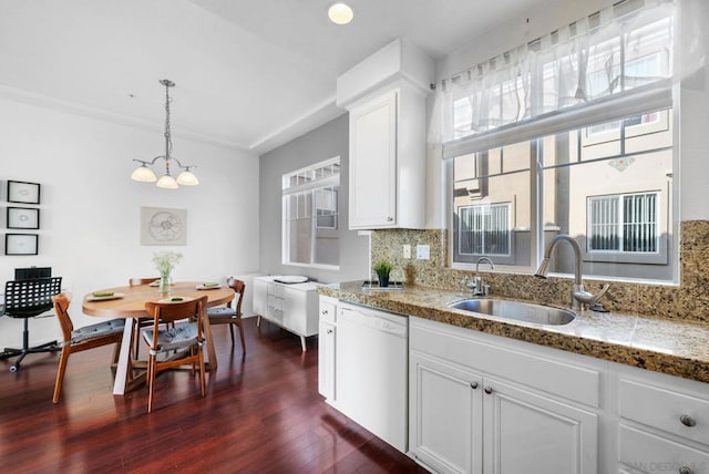 kitchen with dishwasher, white cabinetry, sink, dark hardwood / wood-style flooring, and hanging light fixtures