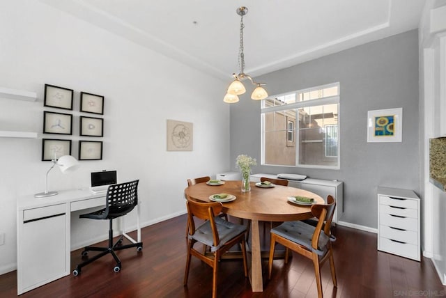 dining space with dark hardwood / wood-style flooring