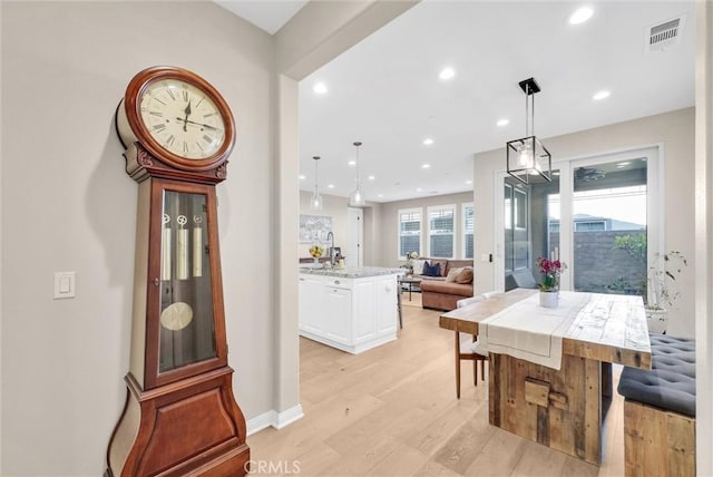 dining area with light hardwood / wood-style flooring