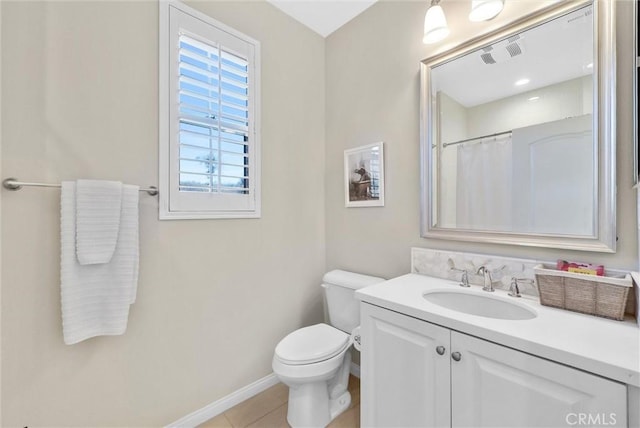 bathroom featuring tile patterned flooring, vanity, a shower with shower curtain, and toilet