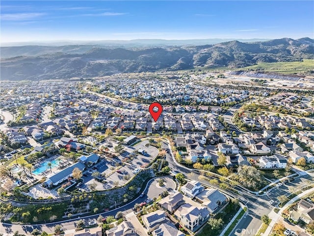 drone / aerial view featuring a mountain view