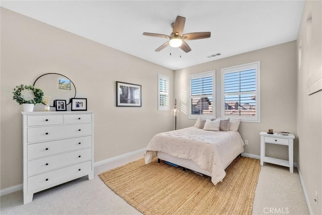 carpeted bedroom with ceiling fan