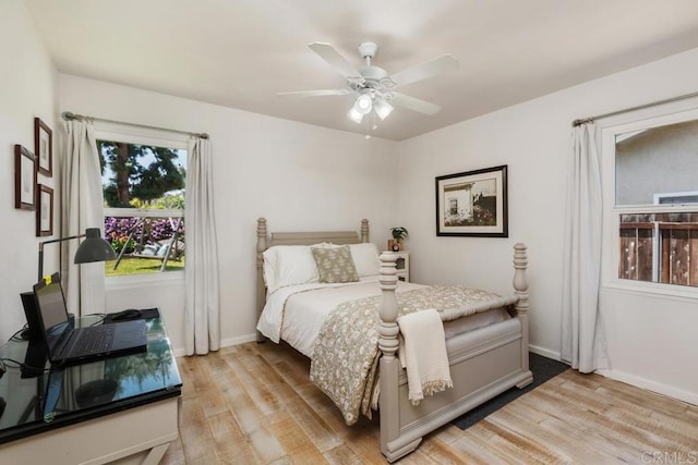 bedroom with ceiling fan and light hardwood / wood-style flooring