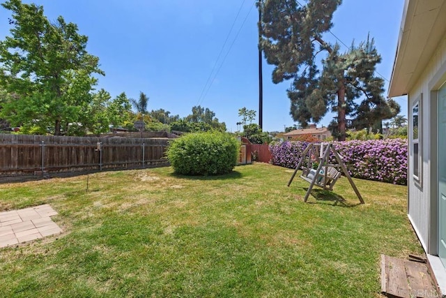 view of yard featuring a fenced backyard