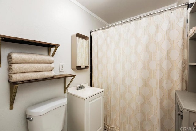 bathroom featuring vanity, ornamental molding, toilet, and a shower with shower curtain