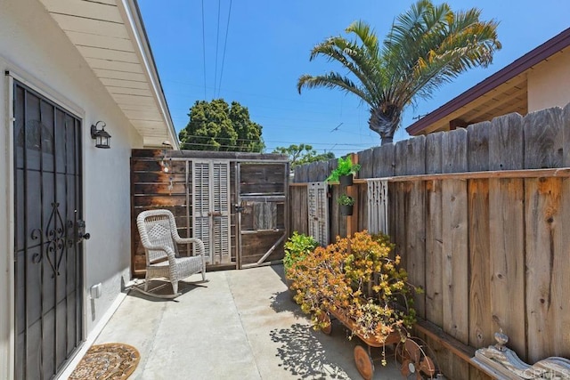 view of patio / terrace featuring fence