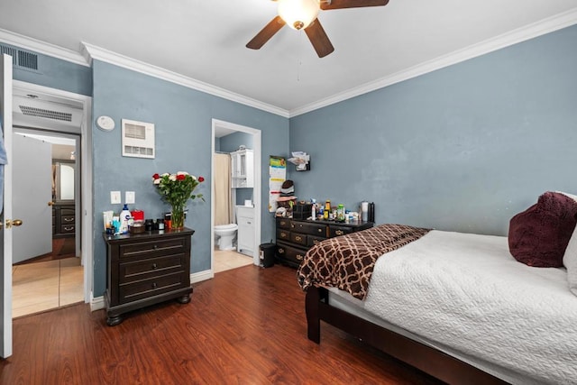 bedroom featuring hardwood / wood-style flooring, ceiling fan, ornamental molding, and connected bathroom