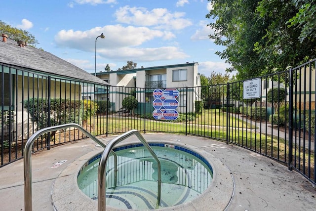 view of pool featuring a community hot tub