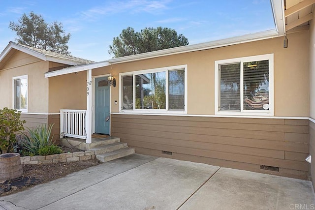 doorway to property featuring a patio