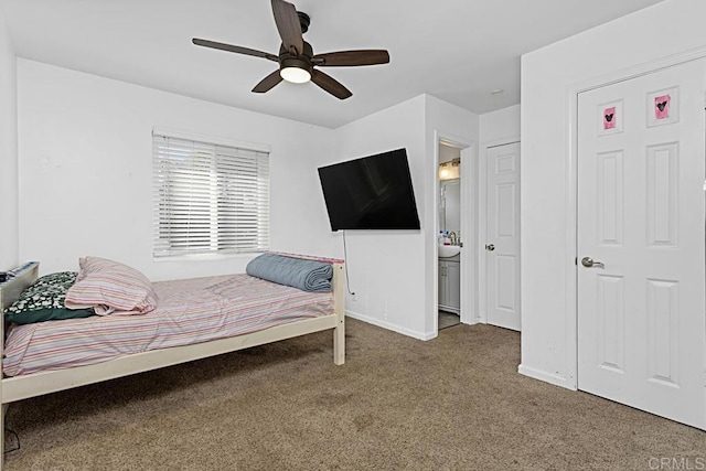 bedroom featuring carpet floors, ceiling fan, and ensuite bathroom