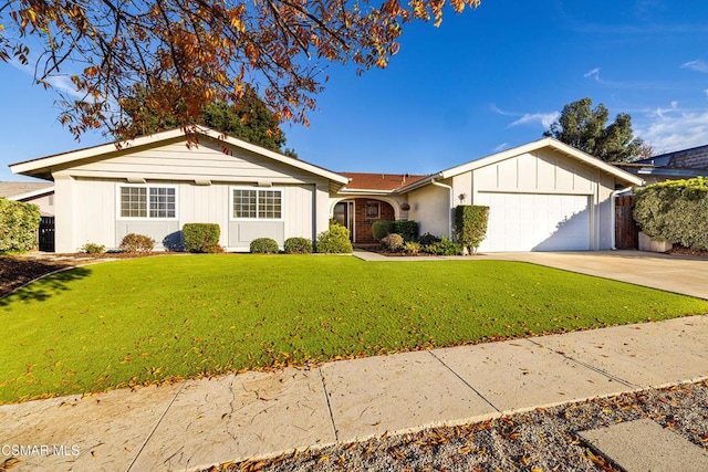 ranch-style home with a garage and a front lawn