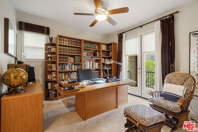 office space featuring light colored carpet and ceiling fan