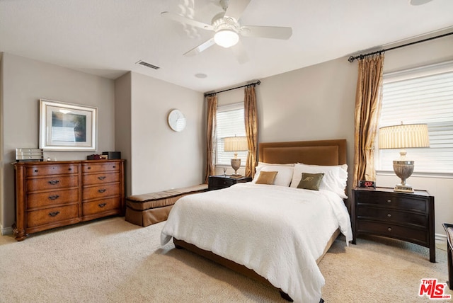 carpeted bedroom with ceiling fan