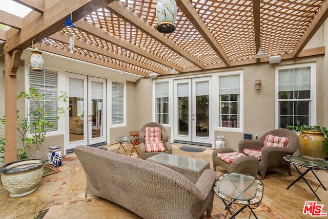 view of patio / terrace with outdoor lounge area, french doors, and a pergola