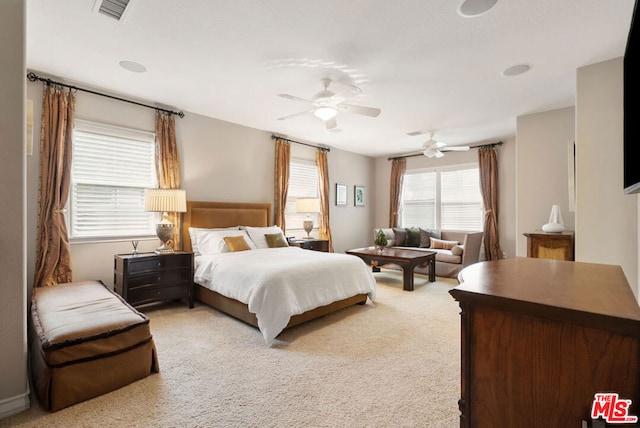 carpeted bedroom with ceiling fan