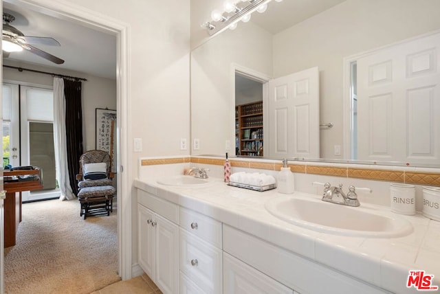 bathroom with ceiling fan and vanity