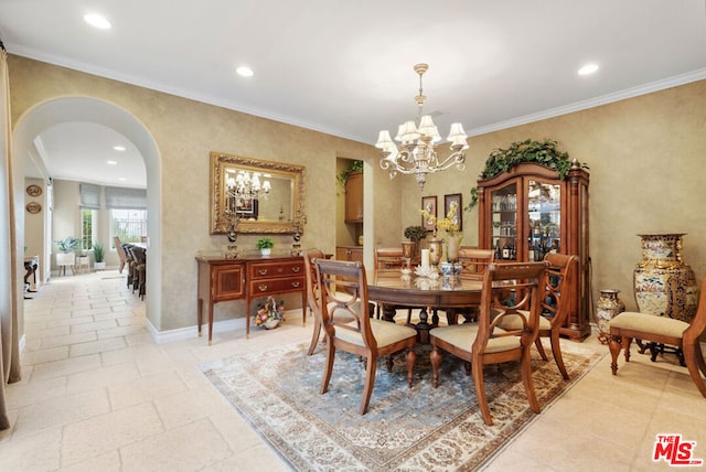 dining area featuring crown molding and a notable chandelier