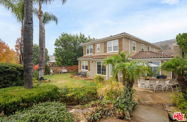 back of property with a patio area