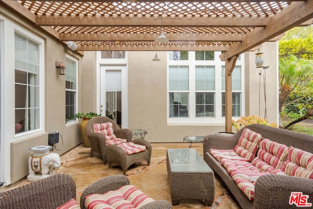 view of patio / terrace with outdoor lounge area and a pergola