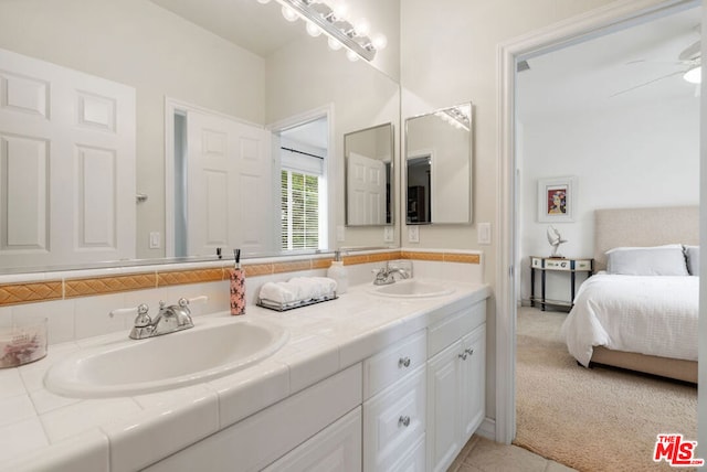 bathroom featuring ceiling fan and vanity