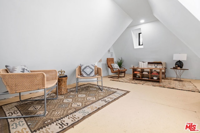 living area with vaulted ceiling