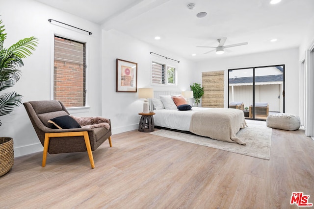 bedroom with light hardwood / wood-style floors and ceiling fan