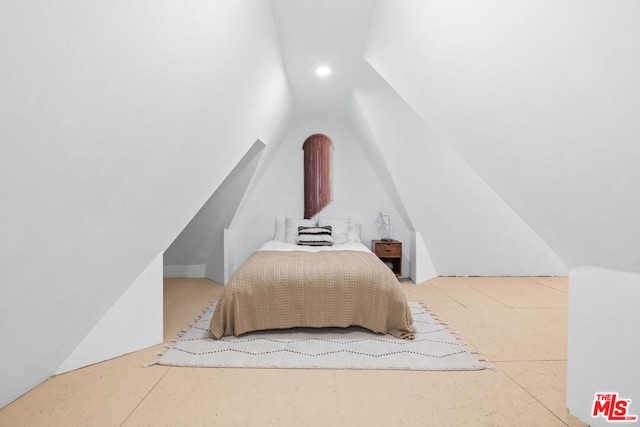 bedroom with vaulted ceiling