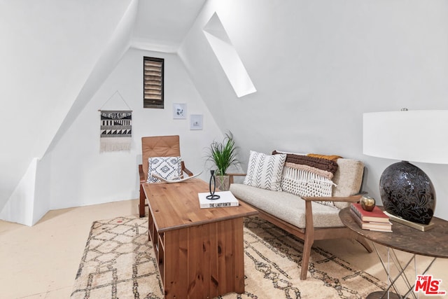 living area with lofted ceiling with skylight