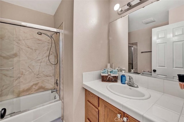 bathroom featuring vanity and shower / bath combination