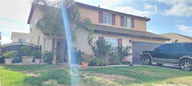 view of front facade with a front yard and a garage