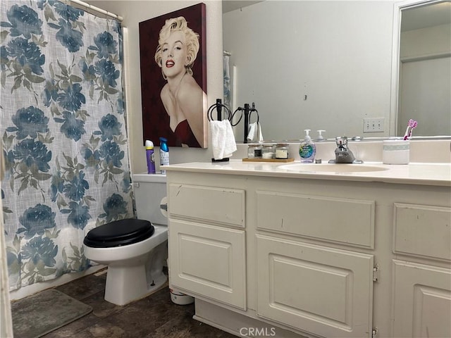 full bathroom with toilet, vanity, and shower / bath combo with shower curtain