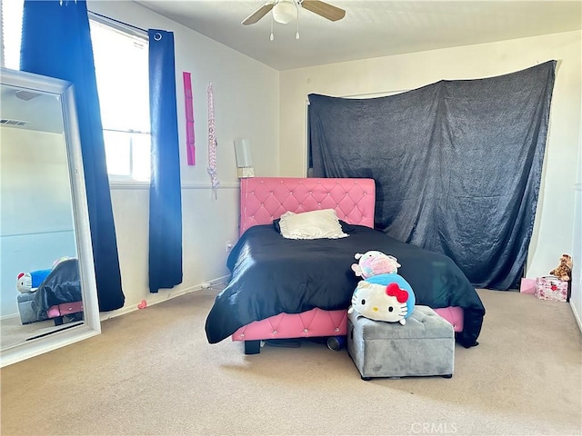 bedroom with ceiling fan and carpet floors