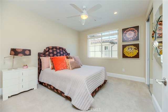 carpeted bedroom featuring ceiling fan