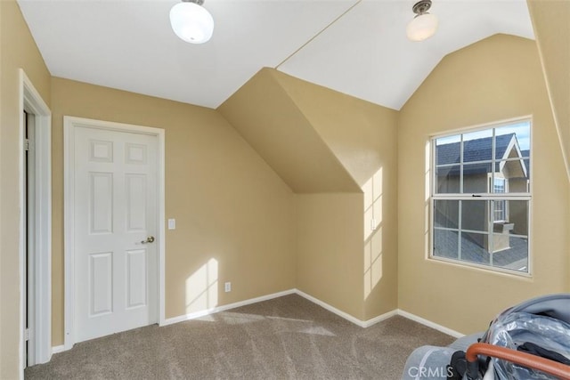 bonus room featuring carpet flooring and lofted ceiling