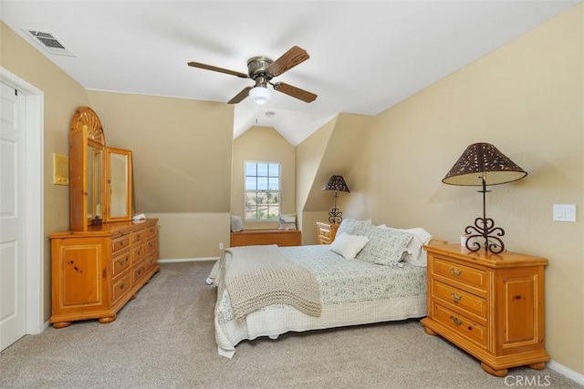 carpeted bedroom featuring ceiling fan and lofted ceiling