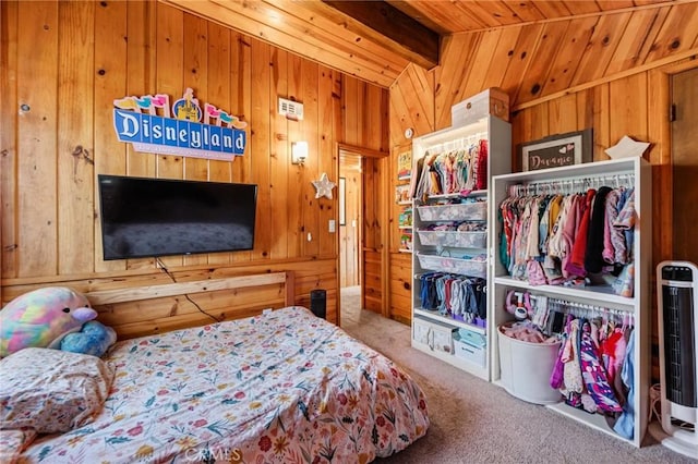 carpeted bedroom featuring vaulted ceiling with beams, wooden walls, and wooden ceiling