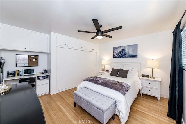 bedroom featuring a closet, light hardwood / wood-style flooring, and ceiling fan