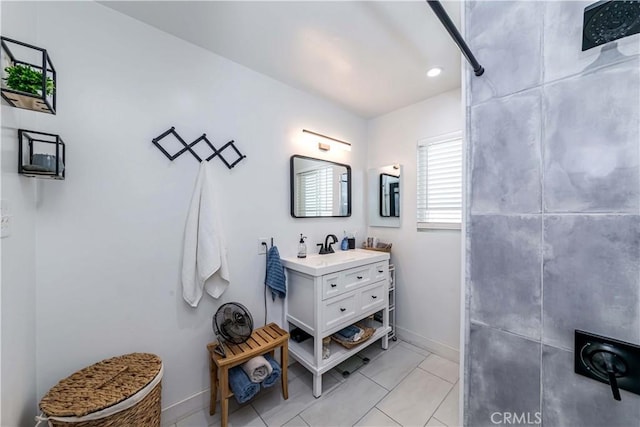 bathroom with tile patterned flooring and vanity