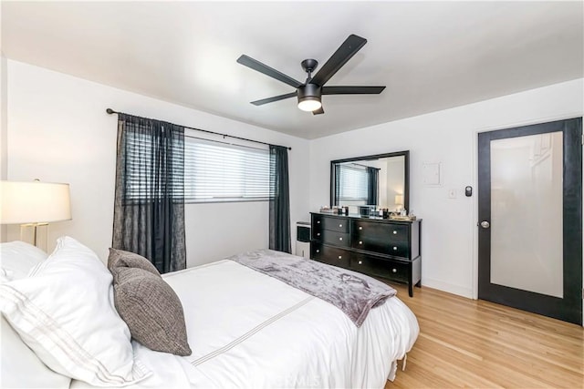 bedroom featuring ceiling fan and light hardwood / wood-style flooring