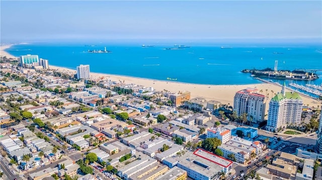 bird's eye view featuring a view of the beach and a water view