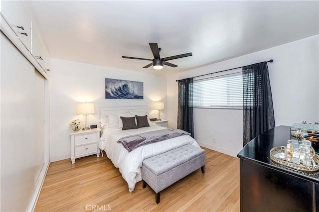 bedroom with ceiling fan and light hardwood / wood-style flooring