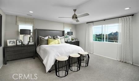 bedroom featuring light colored carpet and ceiling fan