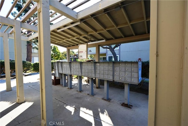 view of patio with a mail area