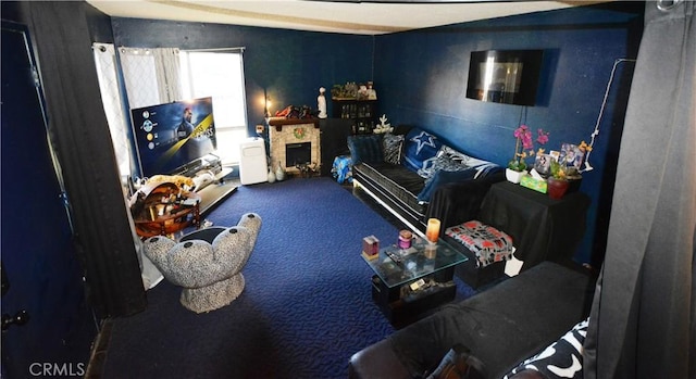 interior space with a stone fireplace and carpet floors