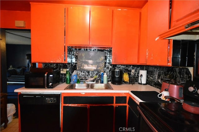 kitchen with custom exhaust hood, black appliances, sink, tile patterned flooring, and tasteful backsplash