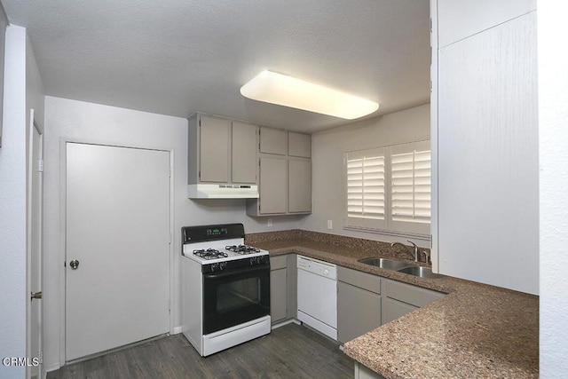 kitchen featuring a textured ceiling, white appliances, sink, gray cabinets, and dark hardwood / wood-style floors