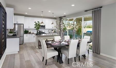 dining area featuring light hardwood / wood-style flooring