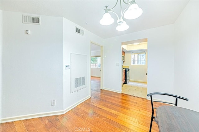 dining area with a chandelier and hardwood / wood-style floors