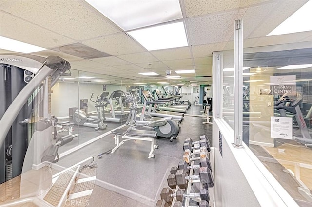 workout area featuring a paneled ceiling