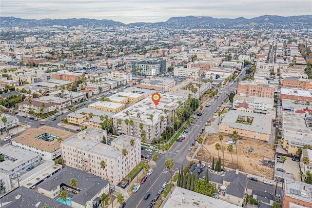 drone / aerial view featuring a mountain view